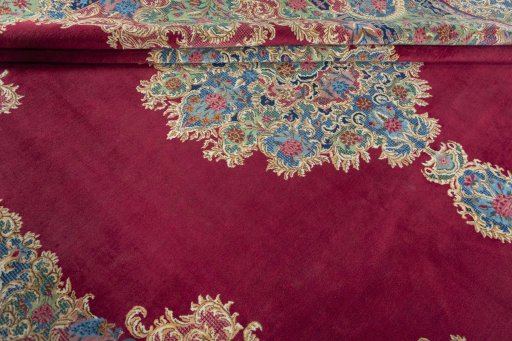 Close-up detail of 1950s Kerman rug from Iran / Persia showing Wool weave