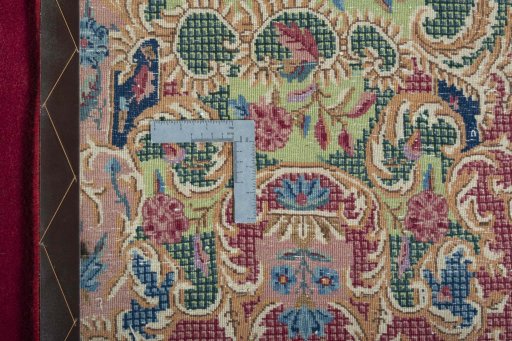 Backside of handmade 1950s Kerman rug showing knot structure and weave density