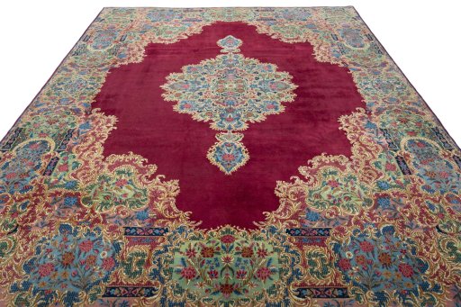 Surface texture of 1950s Kerman rug with natural Wool and intricate pattern
