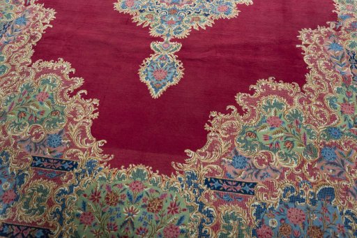 Close-up detail of 1950s Kerman rug from Iran / Persia showing Wool weave