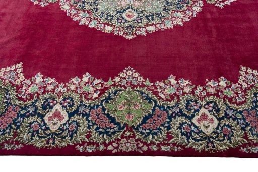 Corner detail of 1970s Kerman rug showing border pattern and Wool pile