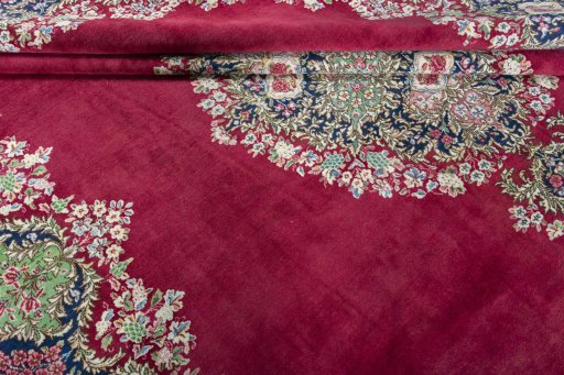 Close-up detail of 1970s Kerman rug from Iran / Persia showing Wool weave
