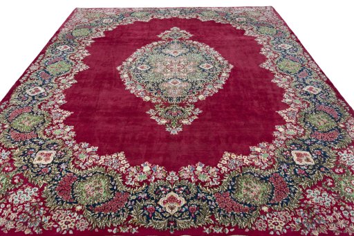 Surface texture of 1970s Kerman rug with natural Wool and intricate pattern