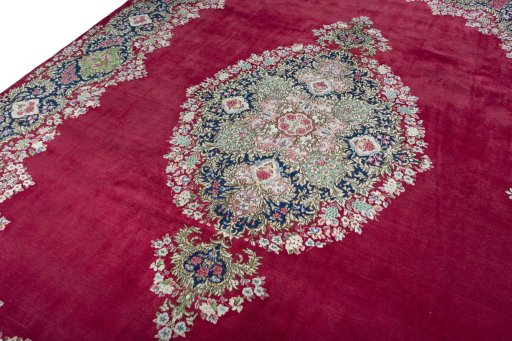Backside of handmade 1970s Kerman rug showing knot structure and weave density