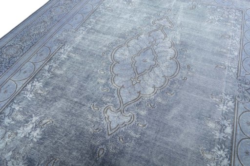 Backside of handmade 1970s Kerman rug showing knot structure and weave density