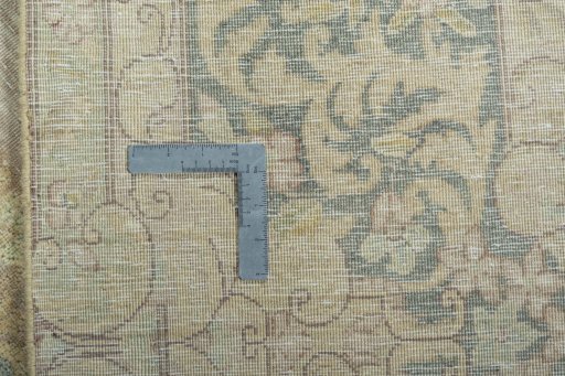 Backside of handmade 1970s Kerman rug showing knot structure and weave density
