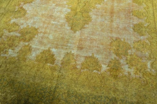 Close-up detail of 1970s Kerman rug from Iran / Persia showing Wool weave