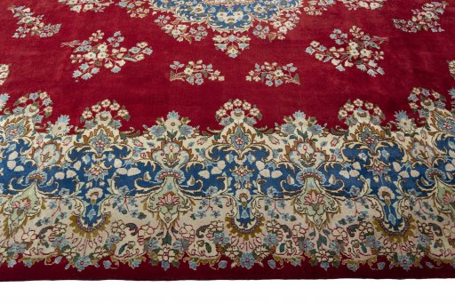 Corner detail of 2000s Kerman rug showing border pattern and Wool pile
