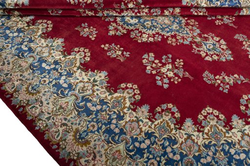 Close-up detail of 2000s Kerman rug from Iran / Persia showing Wool weave