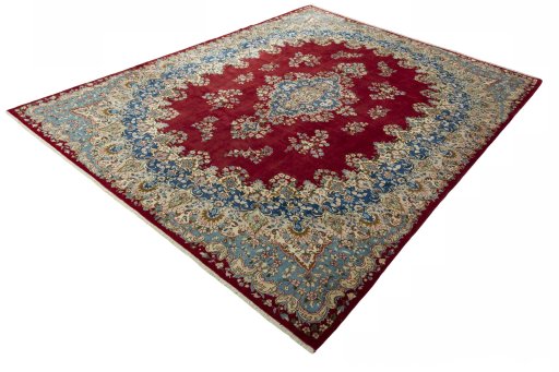 Corner detail of 2000s Kerman rug showing border pattern and Wool pile