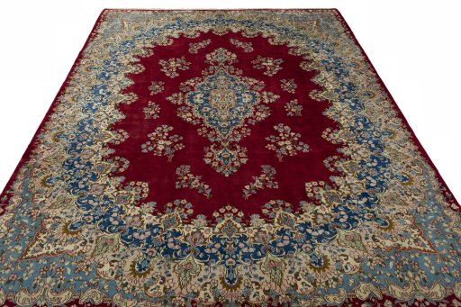 Surface texture of 2000s Kerman rug with natural Wool and intricate pattern