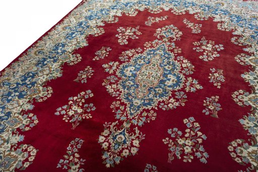 Backside of handmade 2000s Kerman rug showing knot structure and weave density