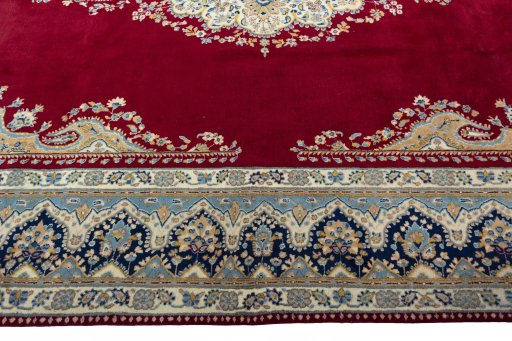 Corner detail of 2000s Kerman rug showing border pattern and Wool pile