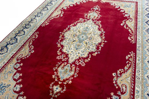 Backside of handmade 2000s Kerman rug showing knot structure and weave density