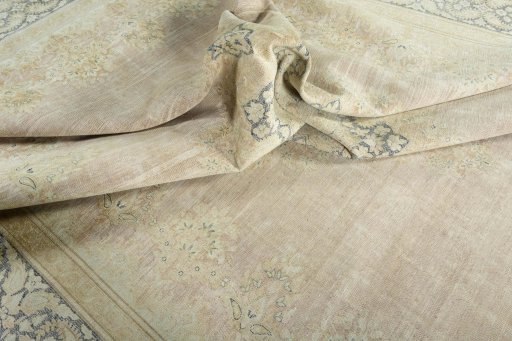 Surface texture of 1950s Kerman rug with natural Wool and intricate pattern