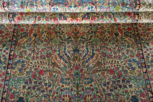 Close-up detail of 2000s Kerman rug from Iran / Persia showing Wool weave