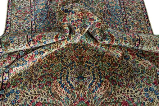 Surface texture of 2000s Kerman rug with natural Wool and intricate pattern