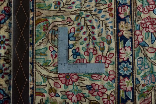 Backside of handmade 2000s Kerman rug showing knot structure and weave density