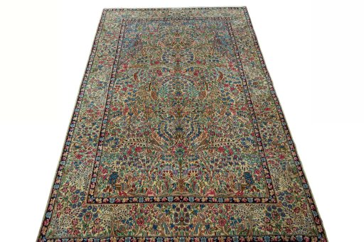 Surface texture of 2000s Kerman rug with natural Wool and intricate pattern