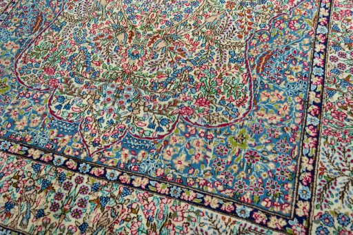 Close-up detail of 2000s Kerman rug from Iran / Persia showing Wool weave