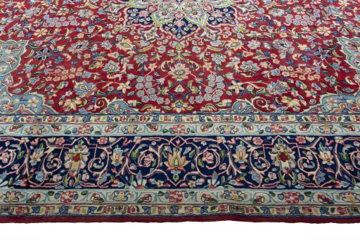 Corner detail of 2000s Kerman rug showing border pattern and Wool pile