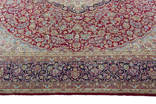 Corner detail of 2000s Kerman rug showing border pattern and Wool pile