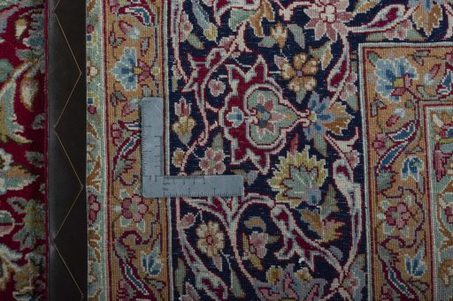 Backside of handmade 2000s Kerman rug showing knot structure and weave density