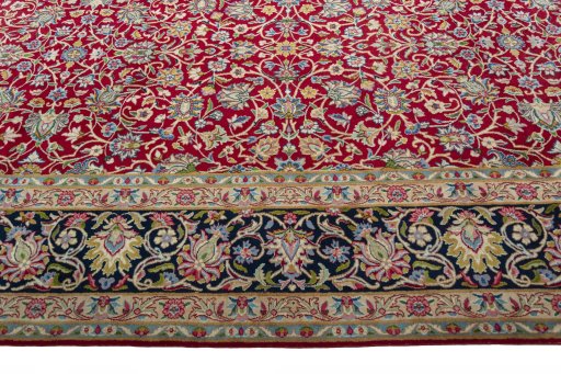 Corner detail of 2000s Kerman rug showing border pattern and Wool pile