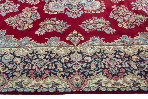 Corner detail of 2000s Kerman rug showing border pattern and Wool pile