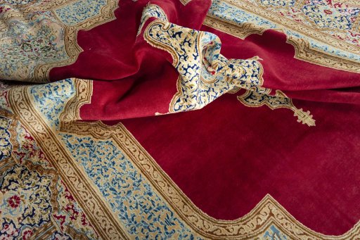 Surface texture of 2000s Kerman rug with natural Wool and intricate pattern