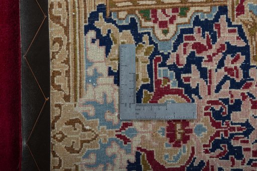 Backside of handmade 2000s Kerman rug showing knot structure and weave density