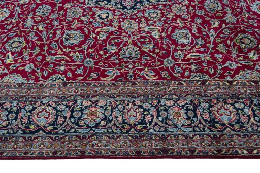 Corner detail of 2000s Kerman rug showing border pattern and Wool pile