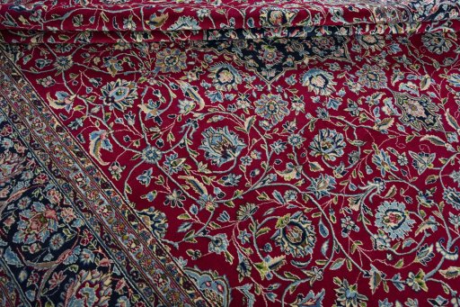 Close-up detail of 2000s Kerman rug from Iran / Persia showing Wool weave