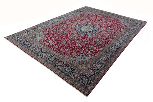 Corner detail of 2000s Kerman rug showing border pattern and Wool pile