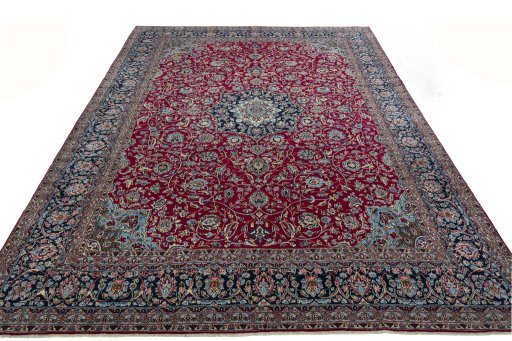 Surface texture of 2000s Kerman rug with natural Wool and intricate pattern