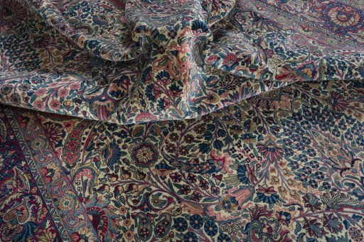 Surface texture of 1930s Kerman rug with natural Wool and intricate pattern