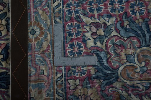 Backside of handmade 1930s Kerman rug showing knot structure and weave density