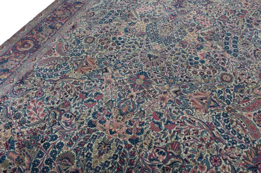 Backside of handmade 1930s Kerman rug showing knot structure and weave density