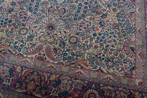 Close-up detail of 1930s Kerman rug from Iran / Persia showing Wool weave