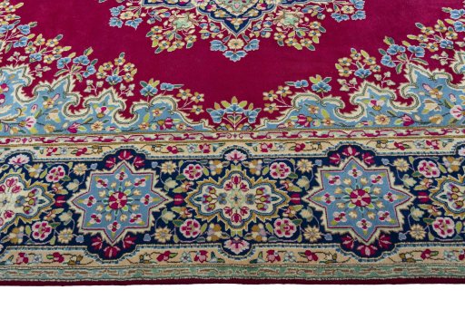 Corner detail of 1970s Kerman rug showing border pattern and Wool pile