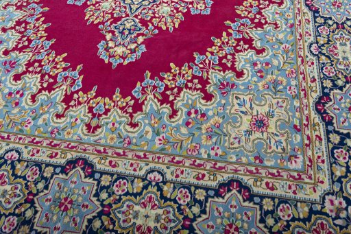 Close-up detail of 1970s Kerman rug from Iran / Persia showing Wool weave