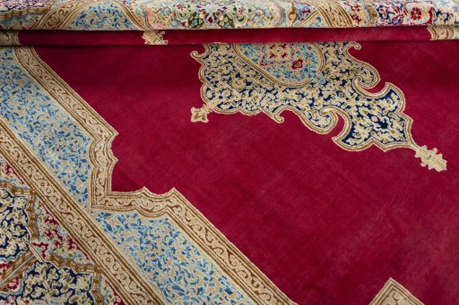 Close-up detail of 2000s Kerman rug from Iran / Persia showing Wool weave