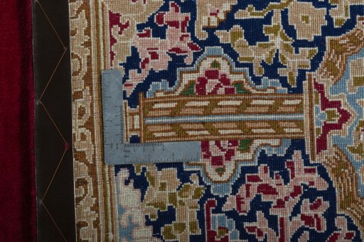 Backside of handmade 2000s Kerman rug showing knot structure and weave density