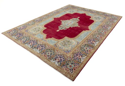 Corner detail of 2000s Kerman rug showing border pattern and Wool pile
