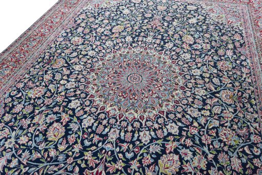 Backside of handmade 2000s Kerman rug showing knot structure and weave density