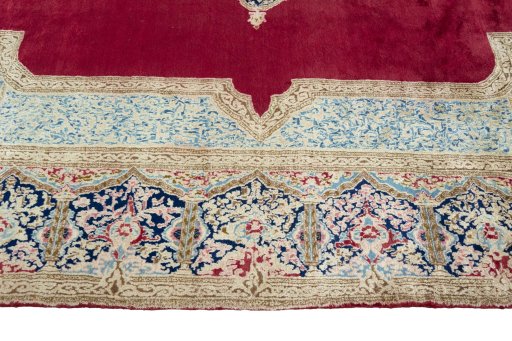 Corner detail of 2000s Kerman rug showing border pattern and Wool pile
