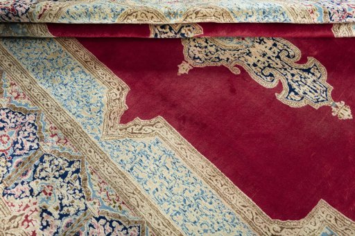 Close-up detail of 2000s Kerman rug from Iran / Persia showing Wool weave