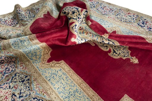 Surface texture of 2000s Kerman rug with natural Wool and intricate pattern
