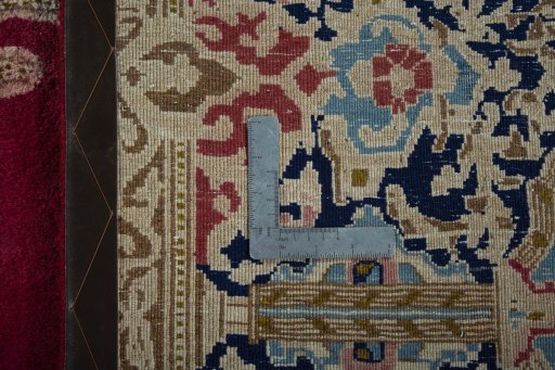 Backside of handmade 2000s Kerman rug showing knot structure and weave density