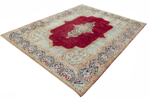 Corner detail of 2000s Kerman rug showing border pattern and Wool pile